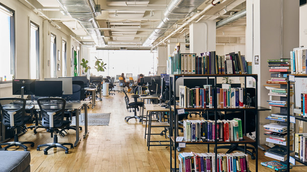 Desks and a bookshelf on the quiet, focused floor