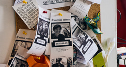 Selfies printed by the receipt printer, pinned to a board